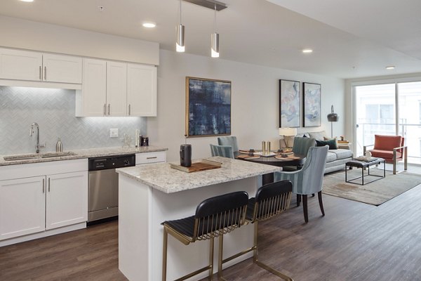 Modern kitchen with stainless steel appliances at Marvelle at Southcenter Apartments
