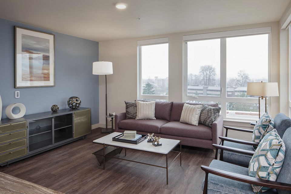 Bright living room with modern furnishings at Marvelle at Southcenter Apartments