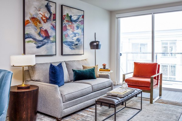Spacious living room with modern decor in Mariblu Southcenter Apartments