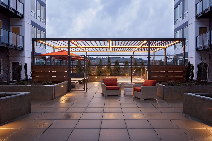 Outdoor grill area with modern amenities at Marvelle at Southcenter Apartments
