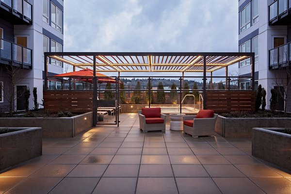 Outdoor grill area with modern amenities at Marvelle at Southcenter Apartments