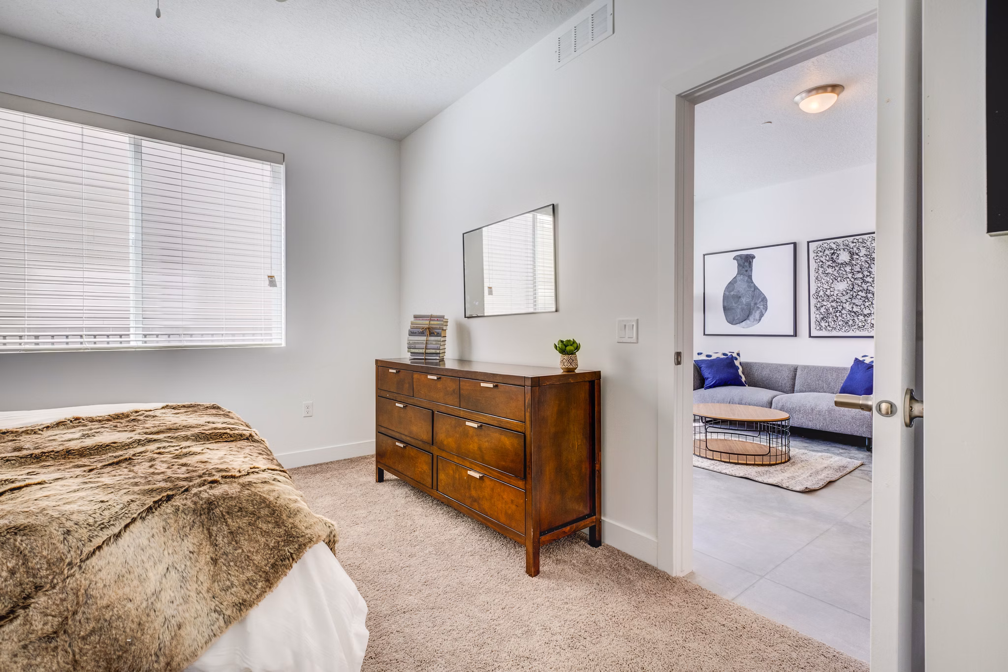 Cozy bedroom with modern decor at Brixton Apartments
