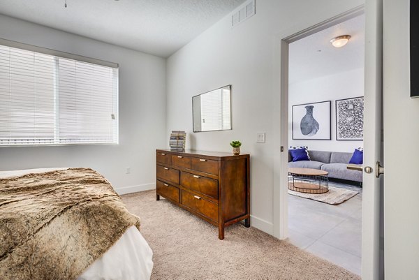 Cozy bedroom with modern decor at Brixton Apartments