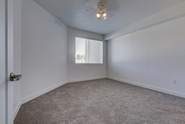 Bedroom featuring stylish decor and modern furniture at Brixton Apartments