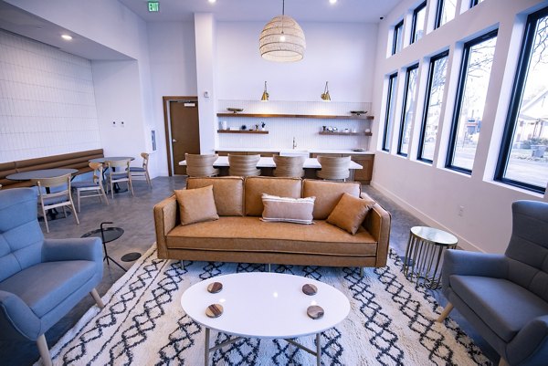Clubhouse featuring stylish modern design at Brixton Apartments, perfect for social gatherings and events in a luxury setting