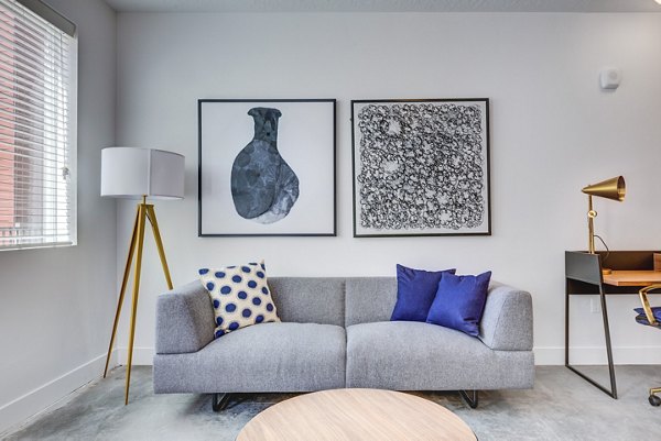 Bright living room with modern furnishings at Brixton Apartments, perfect for luxury living