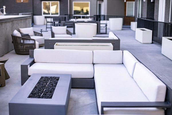 Cozy outdoor fire pit area at Brixton Apartments offering a serene ambiance for relaxation and socializing