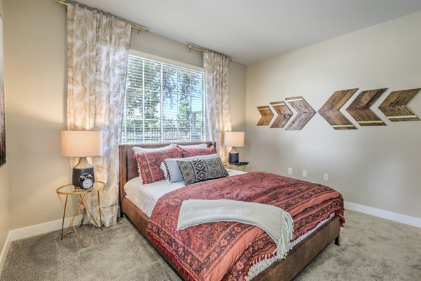 Bedroom featuring modern decor and natural light at Ironwood North Apartments