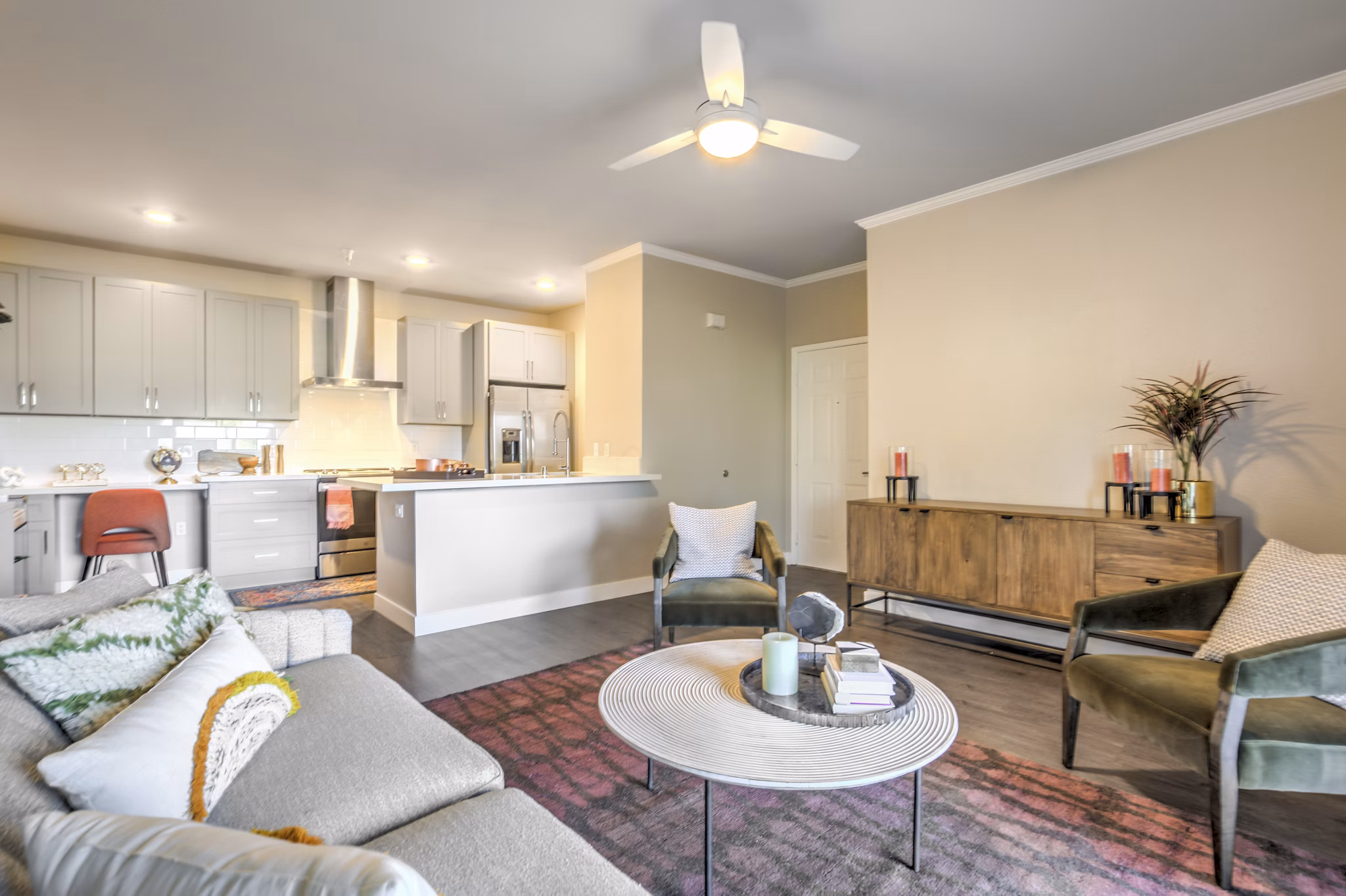 Living room featuring stylish decor and ample natural light at Ironwood North Apartments