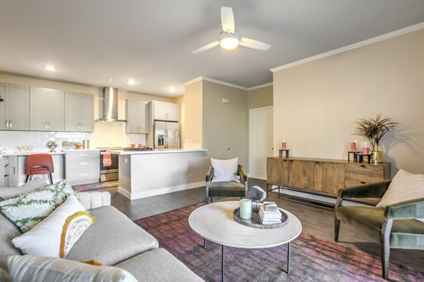 Living room featuring stylish decor and ample natural light at Ironwood North Apartments
