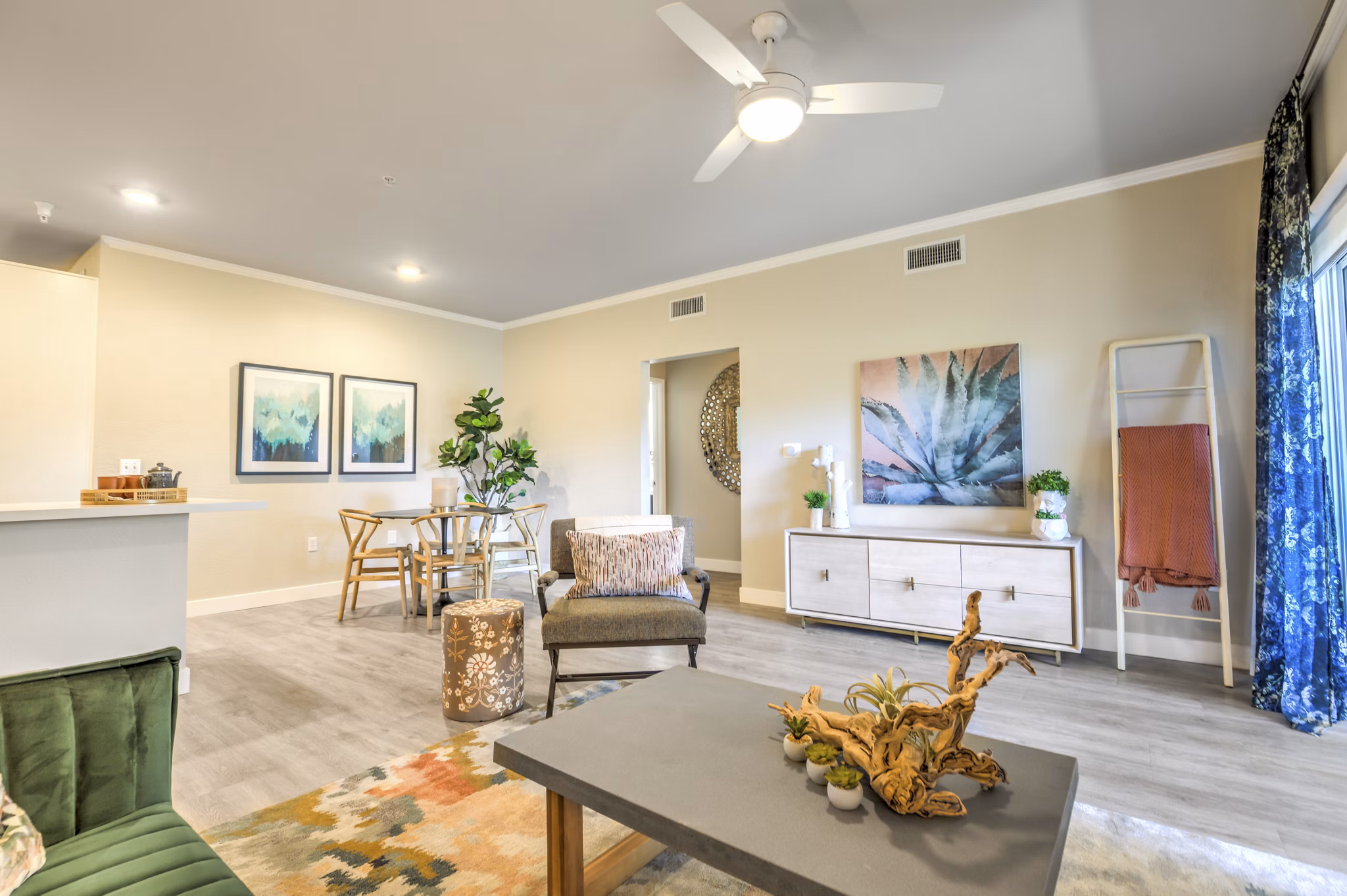 Comfortable living room with large windows at Ironwood North Apartments