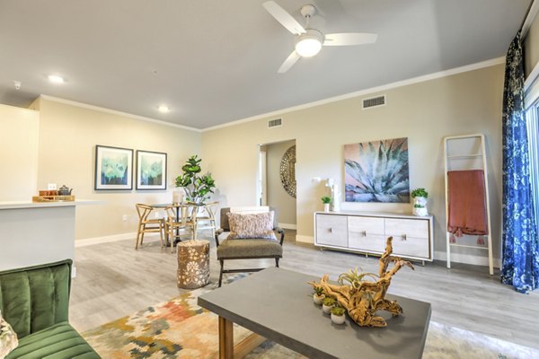 Comfortable living room with large windows at Ironwood North Apartments