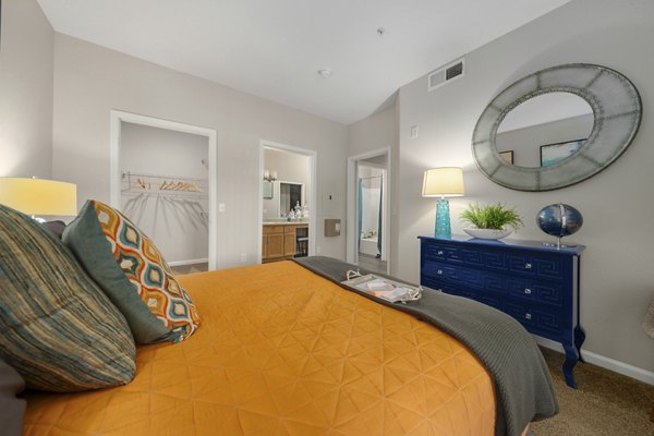 Cozy bedroom with modern furnishings at Artessa Apartments