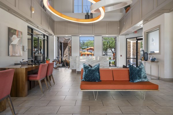 Clubhouse with modern design and cozy seating at Artessa Apartments, offering luxury amenities in a vibrant community