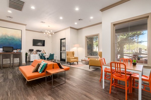 Clubhouse featuring modern dÃ©cor and seating areas at Artessa Apartments luxury community