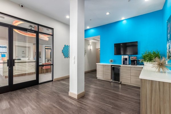 Artessa Apartments: Elegant clubhouse with modern design and comfortable seating in luxury complex