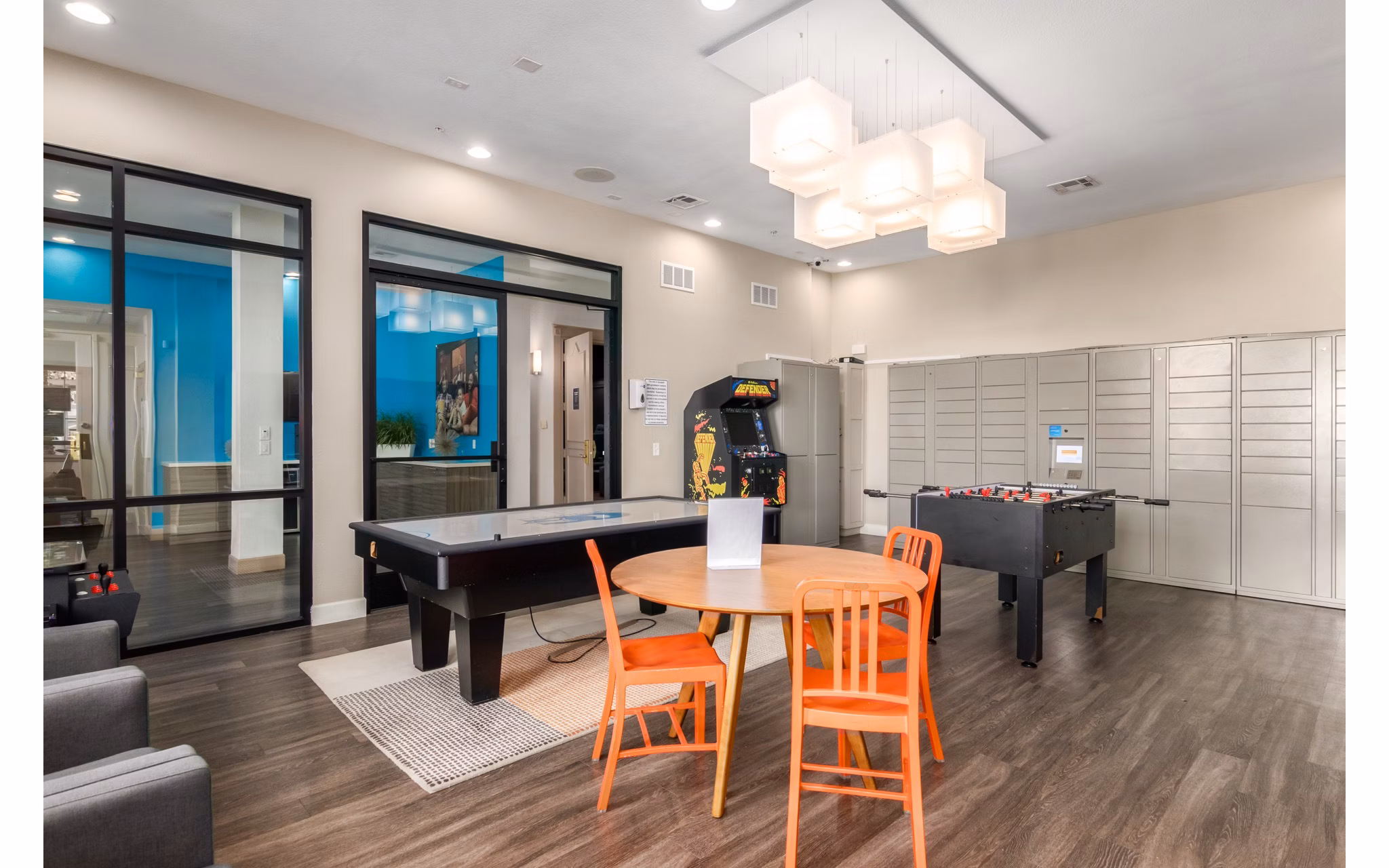 Elegant clubhouse with modern furnishings at Artessa Apartments, ideal for social gatherings and resident events