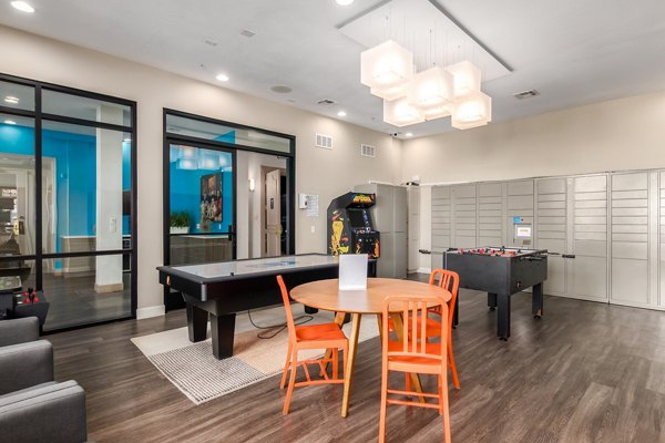 Elegant clubhouse with modern furnishings at Artessa Apartments, ideal for social gatherings and resident events
