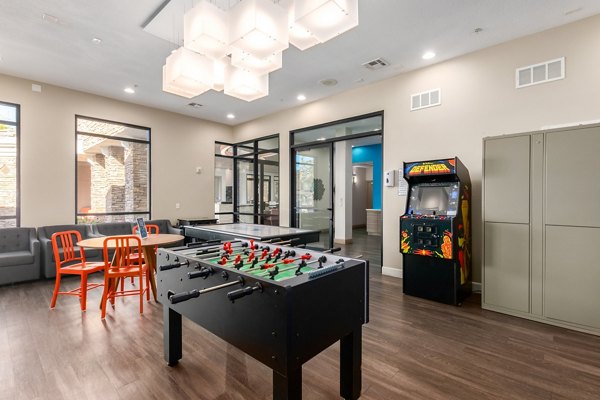 Artessa Apartments: Elegant game room featuring billiards table and lounge seating