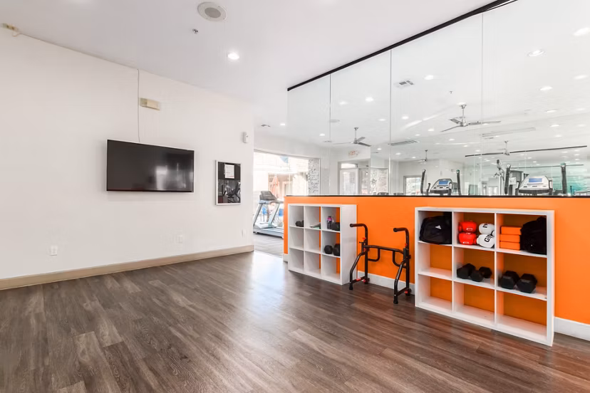 State-of-the-art fitness center at Artessa Apartments with modern equipment and spacious workout areas