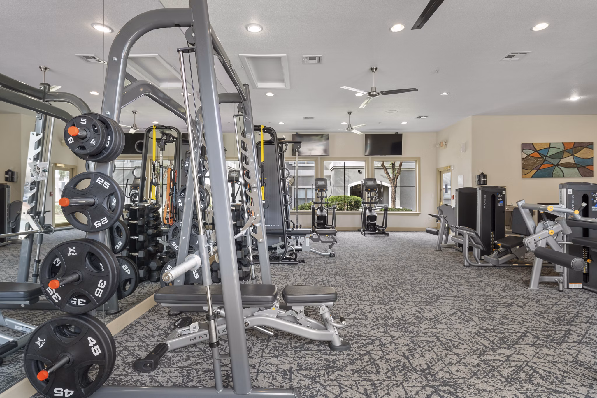 Fitness center with modern equipment at Artessa Apartments in Greystar community