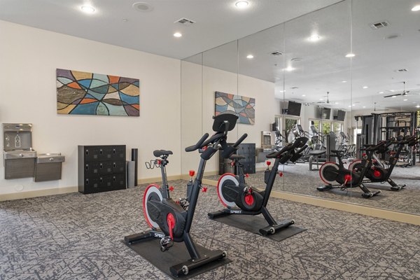 State-of-the-art fitness center at Artessa Apartments with modern equipment and spacious workout areas