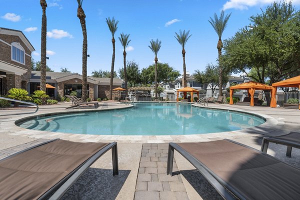 Rooftop pool with chaise lounges at Artessa Apartments offering luxury leisure space for residents