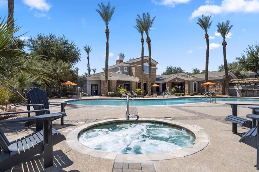Relaxing poolside retreat at Artessa Apartments, perfect for leisure and luxury living in the heart of the community