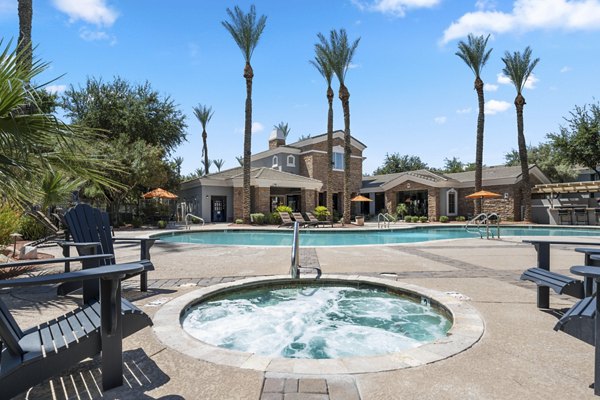 Relaxing poolside retreat at Artessa Apartments, perfect for leisure and luxury living in the heart of the community