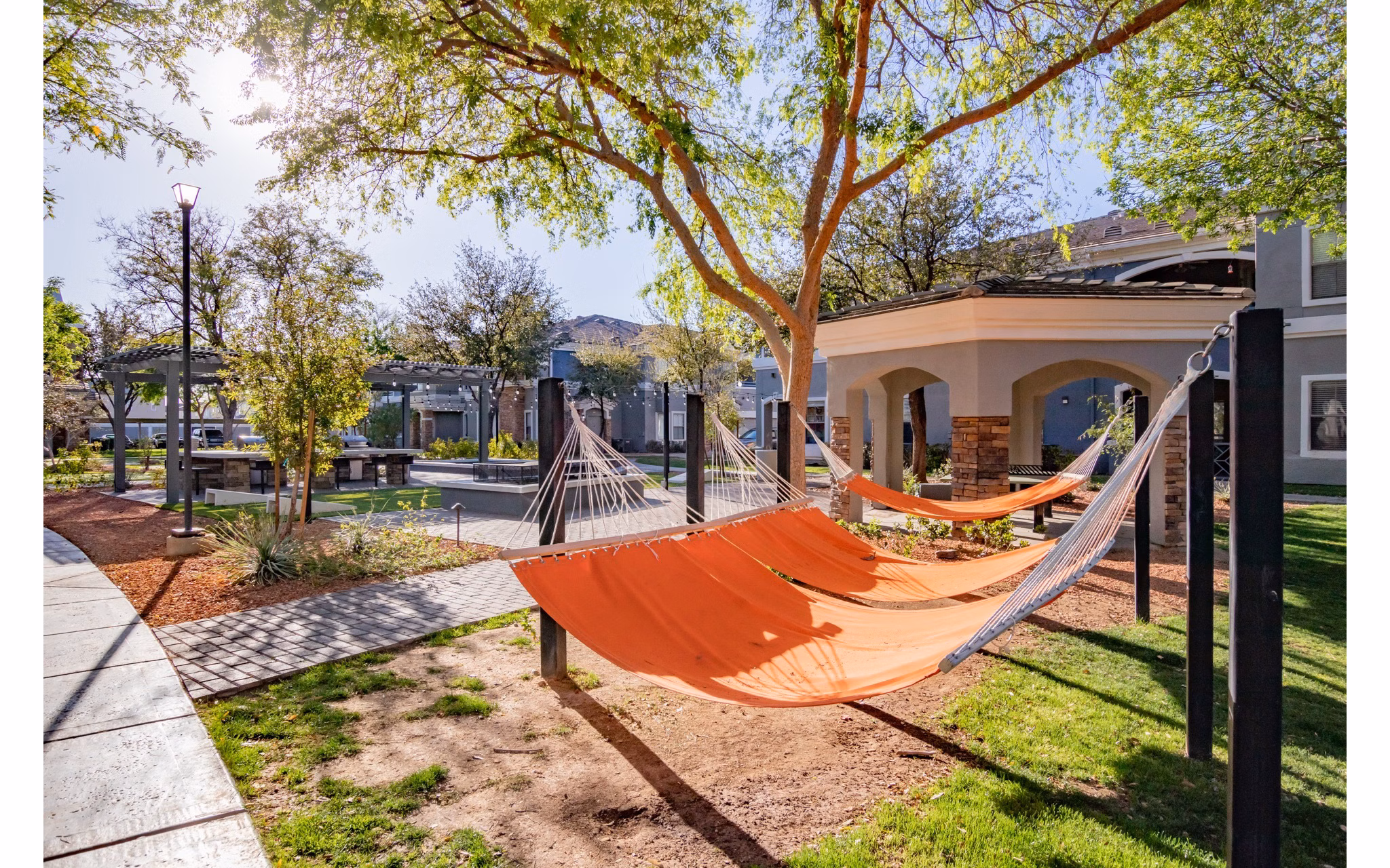 Serene courtyard with lush landscaping at Artessa Apartments, a luxurious living community