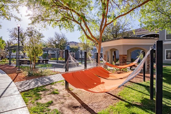 Serene courtyard with lush landscaping at Artessa Apartments, a luxurious living community