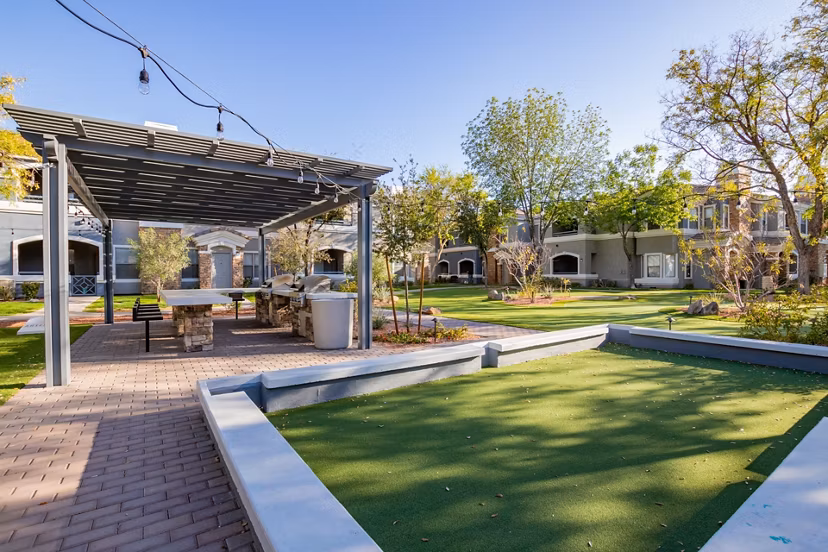 Artessa Apartments: Tranquil courtyard with lush greenery and seating areas in a modern luxury complex