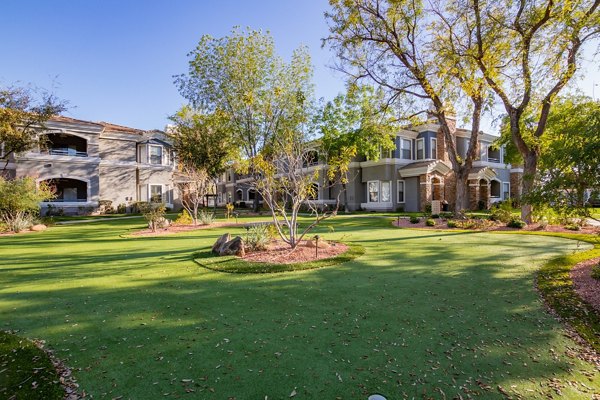Tranquil courtyard with seating and lush greenery at Artessa Apartments luxury apartments