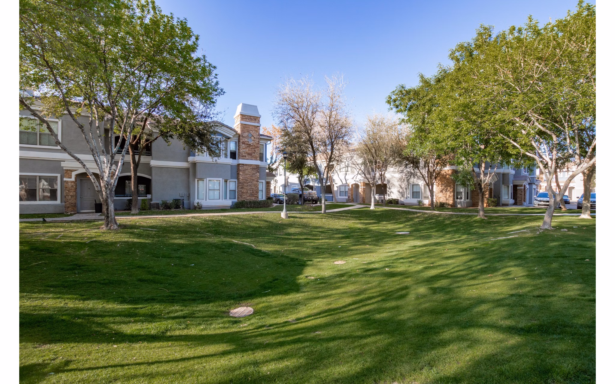 Tranquil courtyard with lush greenery at Artessa Apartments, offering a serene escape within luxury living
