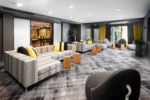 Clubhouse with modern seating and entertainment options at Jefferson Rise Apartments