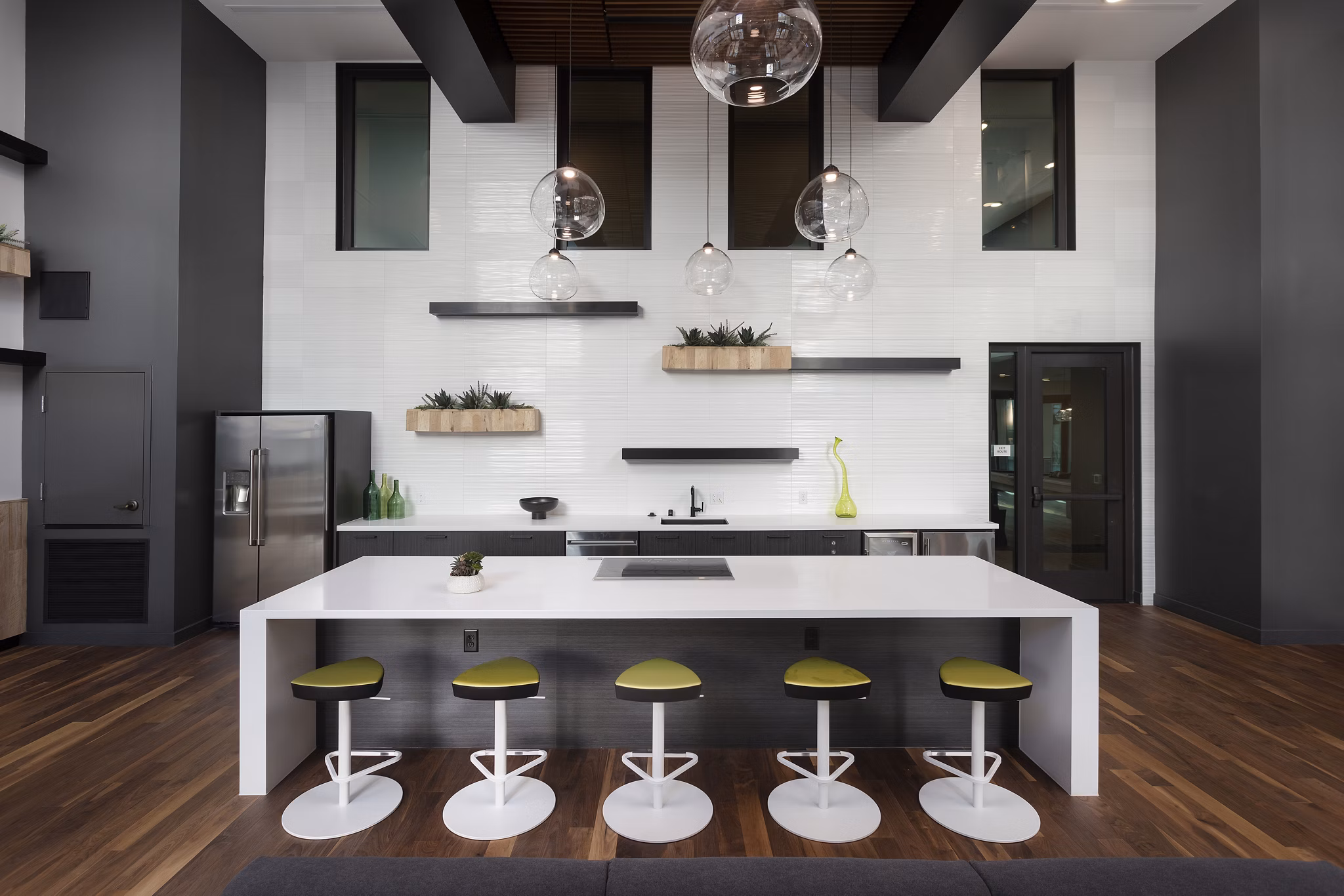 Modern clubhouse with cozy seating areas at Jefferson Rise Apartments, ideal for social gatherings and community events in a luxurious setting