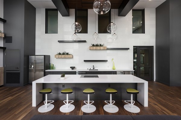 Modern clubhouse with cozy seating areas at Jefferson Rise Apartments, ideal for social gatherings and community events in a luxurious setting