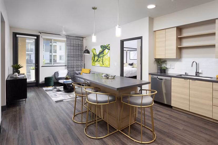 Modern kitchen with sleek appliances and ample counter space at Jefferson Rise Apartments