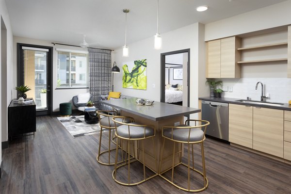 Modern kitchen with sleek appliances and ample counter space at Jefferson Rise Apartments