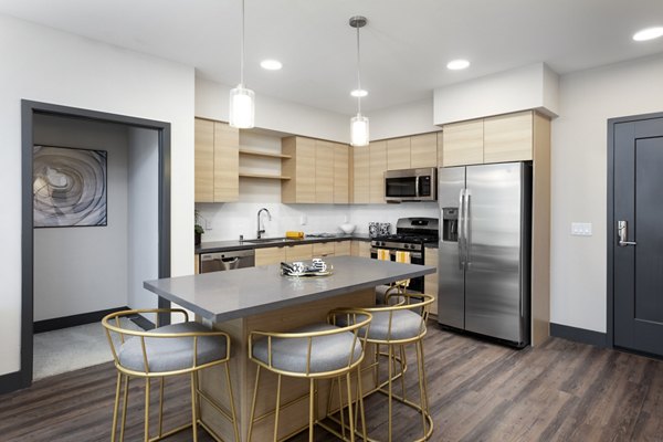 Modern kitchen with stainless steel appliances at Jefferson Rise Apartments