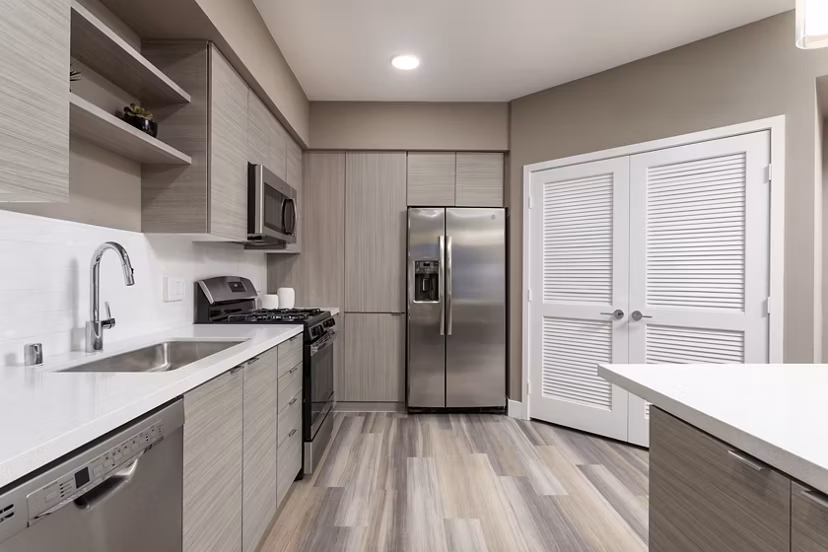 Modern kitchen with stainless steel appliances at Jefferson Rise Apartments