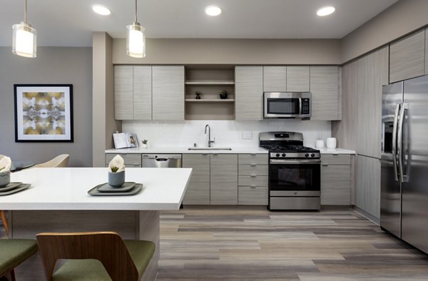 Modern kitchen with stainless steel appliances at Jefferson Rise Apartments