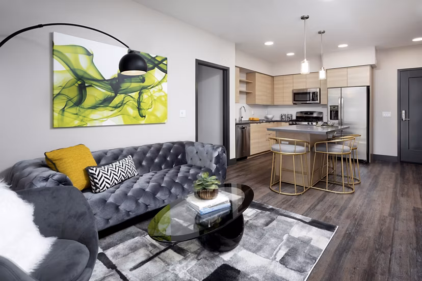 Elegant living room with modern design and plush seating at Jefferson Rise Apartments