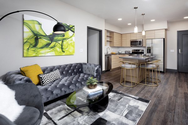 Elegant living room with modern design and plush seating at Jefferson Rise Apartments