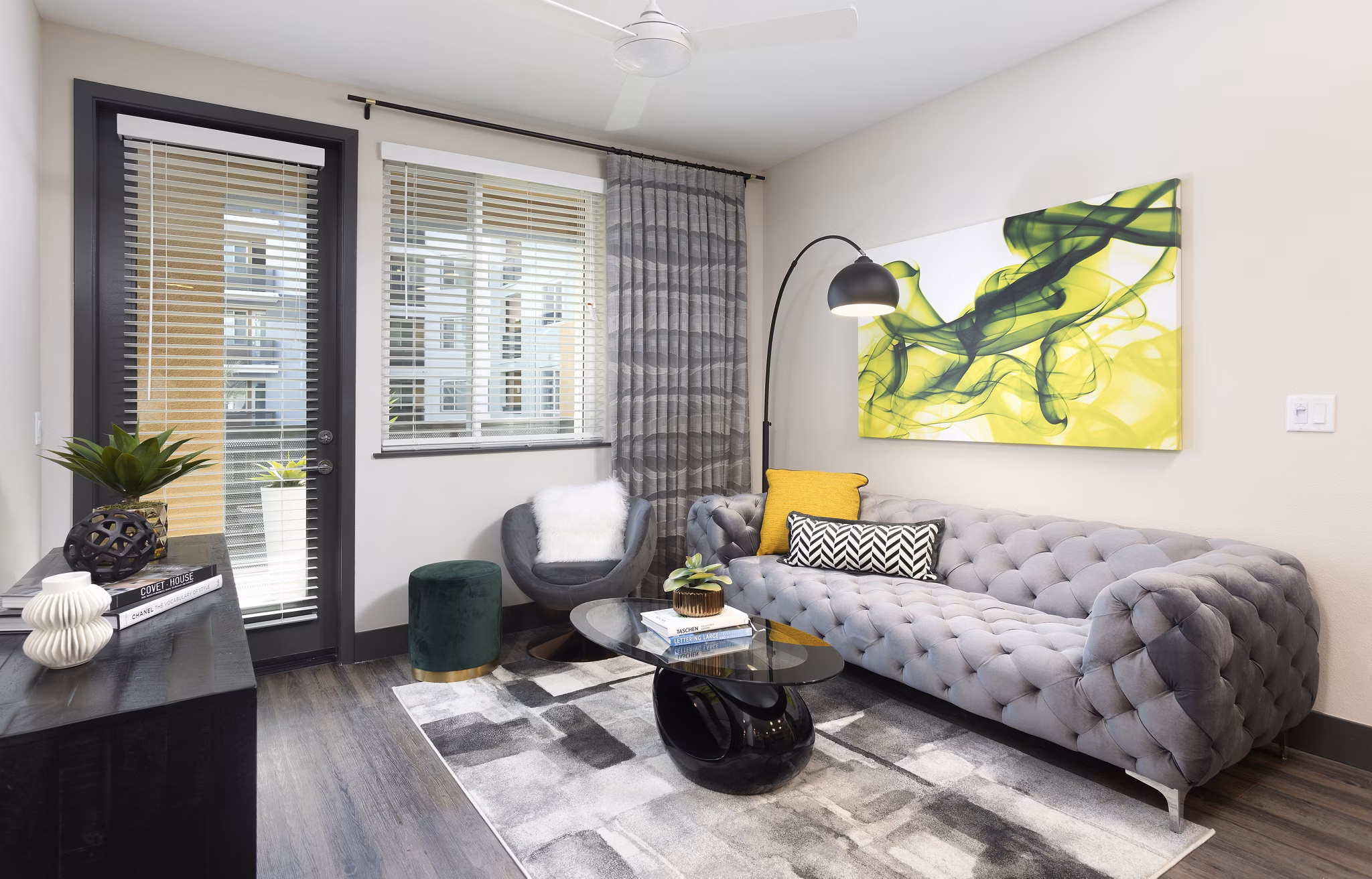 Modern living room with designer furnishings and natural light at Jefferson Rise Apartments