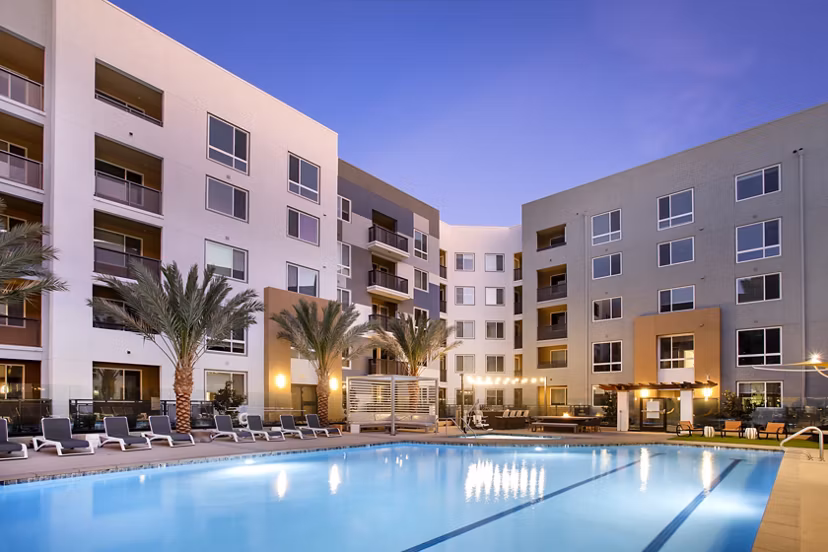 Luxurious pool area with lounge chairs at Jefferson Rise Apartments