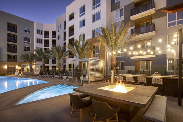 Outdoor fire pit area with comfortable seating at Jefferson Rise Apartments