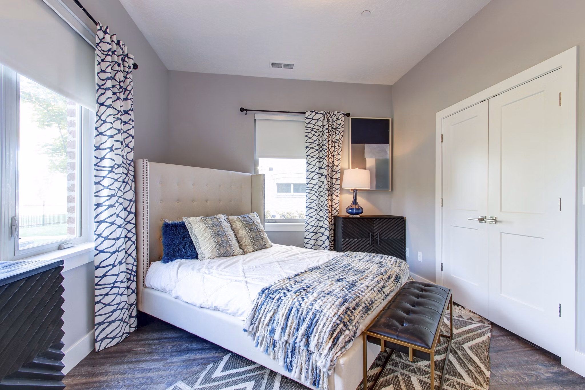 Cozy bedroom with elegant decor at Park East Apartments: Greystar luxury apartments