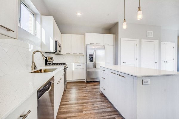 Modern kitchen with stainless steel appliances in Park East Apartments, luxury living in urban settings for contemporary lifestyles
