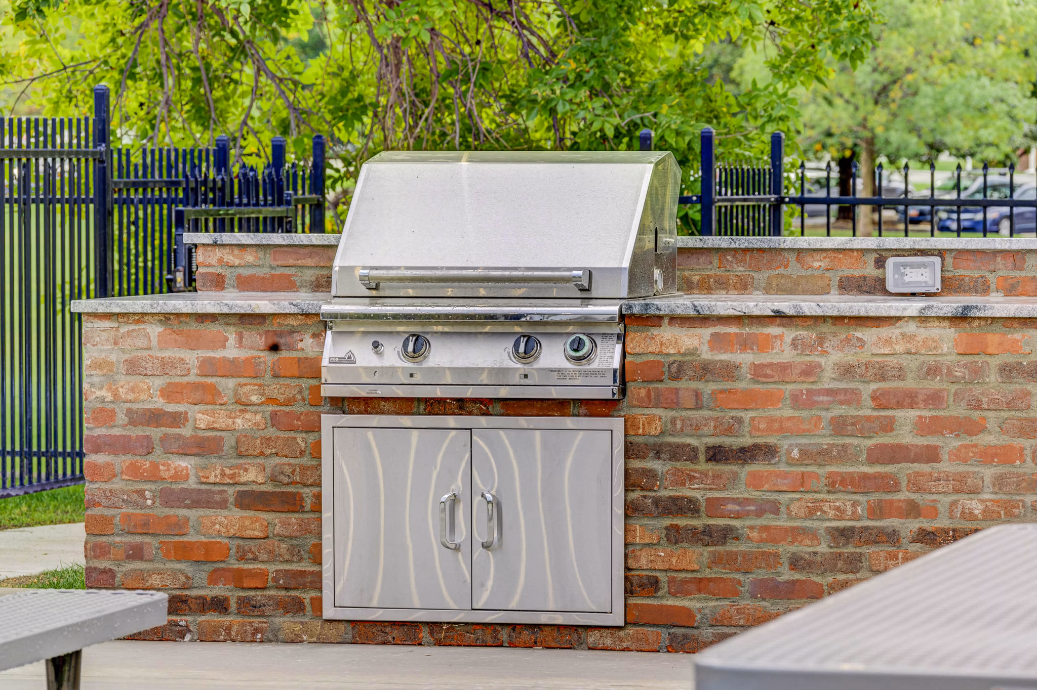Modern outdoor grill area featuring sleek appliances at Park East Apartments, perfect for hosting and dining in style